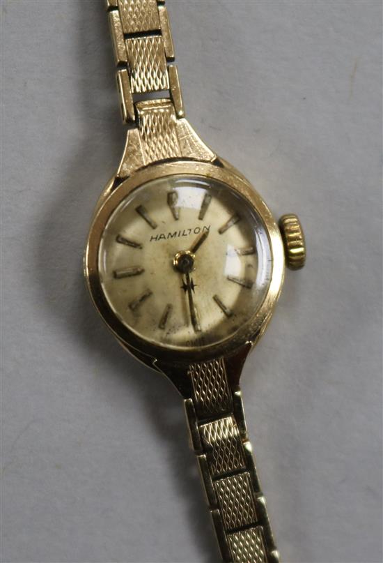 A ladys 9ct gold Hamilton wrist watch, on a 9ct gold bracelet.